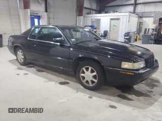 2000 Cadillac Eldorado Touring ETC z VIN 1G6ET1294YU144883, wystawiony jako Copart lot #80979854 z przebiegiem 89 271 mil mil oraz Czysty tytuł • Clean title. Historia ofert i sprzedaży dostępna na DreamBid. Obrazek 4.