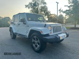 2016 Jeep Wrangler Unlimited Sahara with VIN 1C4BJWEG5GL215915, listed as a Copart auction lot 61690145 with 143,925 mi miles and Clean title. Bid and sale history available at DreamBid. Image 1.