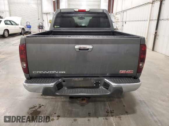 2010 GMC Canyon SLE1 with VIN 1GTJTCDE5A8148716, listed as a Copart auction lot 57559215 with 126,523 mi miles and Salvage title. Bid and sale history available at DreamBid. Image 6.