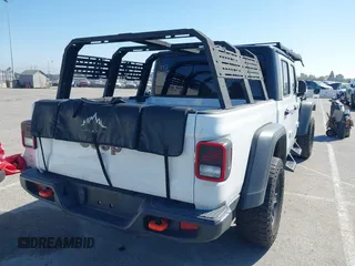 2022 Jeep Gladiator Mojave z VIN 1C6JJTEG0NL103523, wystawiony jako IAAI lot #41842011 z przebiegiem 36 160 mil mil oraz . Historia ofert i sprzedaży dostępna na DreamBid. Obrazek 4.