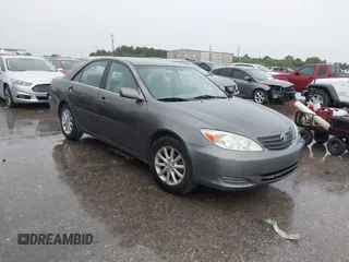 2002 Toyota Camry LE z VIN 4T1BE32K42U578474, wystawiony jako IAAI lot #42490293 z przebiegiem 214 696 mil mil oraz . Historia ofert i sprzedaży dostępna na DreamBid. Obrazek 1.