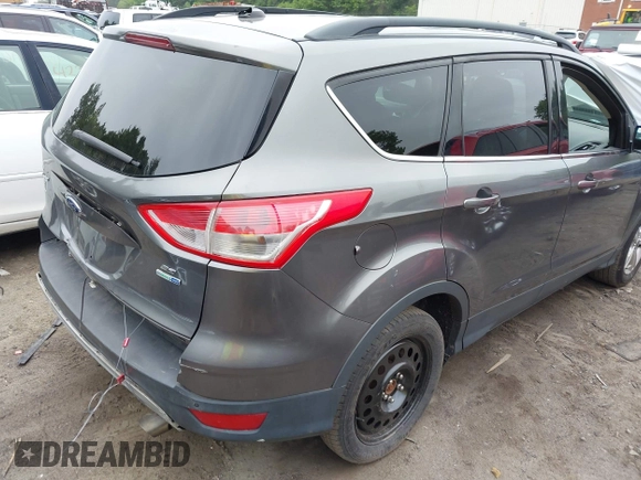 2014 Ford Escape SE with VIN 1FMCU9GX8EUA65568, listed as a IAAI auction lot 42435114 with 128,278 mi miles and . Bid and sale history available at DreamBid. Image 4.