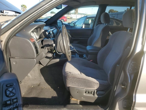 1999 Jeep Grand Cherokee Laredo with VIN 1J4GW58NXXC747537, listed as a Copart auction lot 87310234 with 0 mi miles and Salvage Title. Bid and sale history available at carsss.com. Image 7.