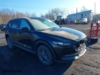 2021 Mazda CX-5 Touring with VIN JM3KFBCM2M1303063, listed as a IAAI auction lot 41814604 with 36,116 mi miles. Bid and sale history available at carsss.com. Image 1.