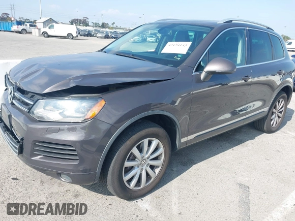 2011 Volkswagen Touareg Sport with VIN WVGFF9BP3BD002517, listed as a IAAI auction lot 42174143 with 156,337 mi miles and . Bid and sale history available at DreamBid. Image 2.