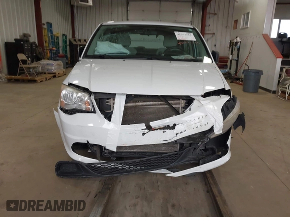 2014 Dodge Grand Caravan American Value with VIN 2C4RDGBG7ER345277, listed as a IAAI auction lot 42061355 with 145,889 mi miles and . Bid and sale history available at DreamBid. Image 12.