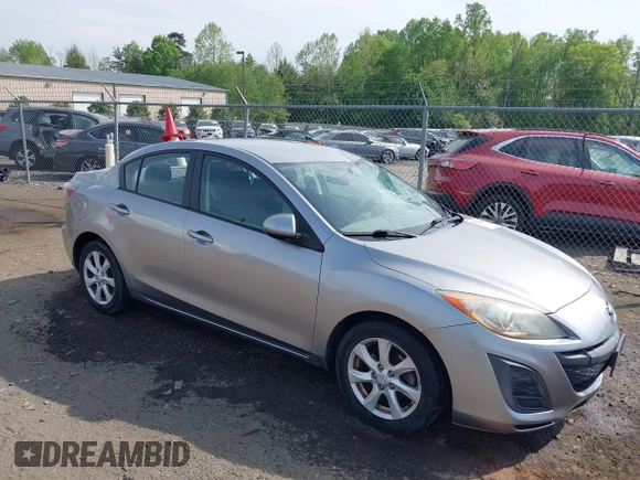 2011 Mazda Mazda3 i Touring with VIN JM1BL1VGXB1372499, listed as a IAAI auction lot 42112283 with 98,564 mi miles. Bid and sale history available at carsss.com. Image 1.
