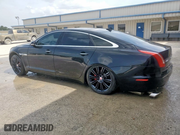 2014 Jaguar XJ Portfolio with VIN SAJWA2GZ2E8V64993, listed as a Copart auction lot 88774965 with 78,689 mi miles and Salvage title. Bid and sale history available at DreamBid. Image 2.
