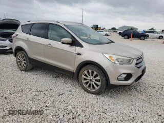 2017 Ford Escape Titanium with VIN 1FMCU0J95HUD40629, listed as a Copart auction lot 54982545 with 206,891 mi miles and Clean Title. Bid and sale history available at DreamBid. Image 4.