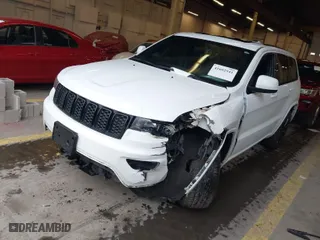 2019 Jeep Grand Cherokee Laredo E with VIN 1C4RJFAG1KC818289, listed as a IAAI auction lot 41602541 with 59,356 mi miles. Bid and sale history available at carsss.com. Image 2.