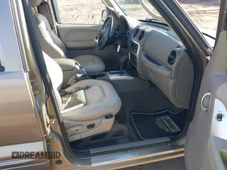 2004 Jeep Liberty Limited with VIN 1J4GL58K14W241524, listed as a IAAI auction lot 41822169 with 136,090 mi miles. Bid and sale history available at carsss.com. Image 5.