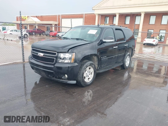 2007 Chevrolet Tahoe LS z VIN 1GNFC13C77R381209, wystawiony jako IAAI lot #41951832 z przebiegiem 145 205 mil mil oraz . Historia ofert i sprzedaży dostępna na DreamBid. Obrazek 2.