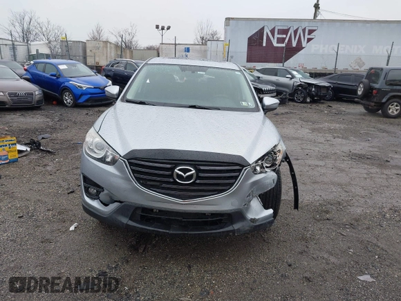 2016 Mazda CX-5 Grand Touring with VIN JM3KE4DY4G0712465, listed as a IAAI auction lot 41859217 with 61,806 mi miles and . Bid and sale history available at carsss.com. Image 13.