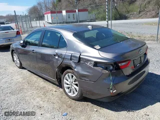 2022 Toyota Camry LE with VIN 4T1C11AK2NU054251, listed as a IAAI auction lot 41880293 with 48,559 mi miles. Bid and sale history available at carsss.com. Image 3.