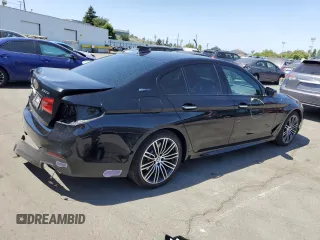 2018 BMW 5 Series 530e with VIN WBAJA9C50JB252458, listed as a Copart auction lot 58697585 with 89,050 mi miles and Salvage title. Bid and sale history available at DreamBid. Image 3.