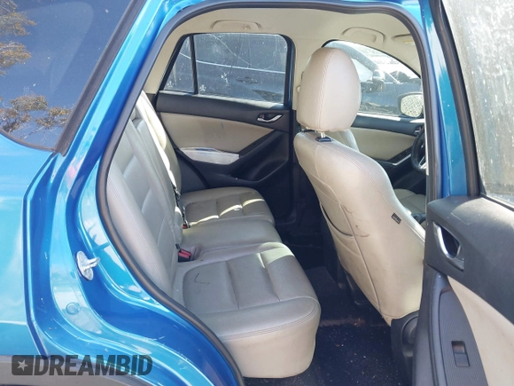 2014 Mazda CX-5 Touring with VIN JM3KE2CYXE0310873, listed as a IAAI auction lot 41309633 with 175,325 mi miles and . Bid and sale history available at DreamBid. Image 8.