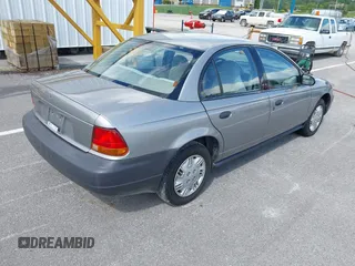 1997 Saturn SL z VIN 1G8ZH5285VZ117635, wystawiony jako IAAI lot #42153929 z przebiegiem 193 224 mil mil oraz . Historia ofert i sprzedaży dostępna na DreamBid. Obrazek 4.