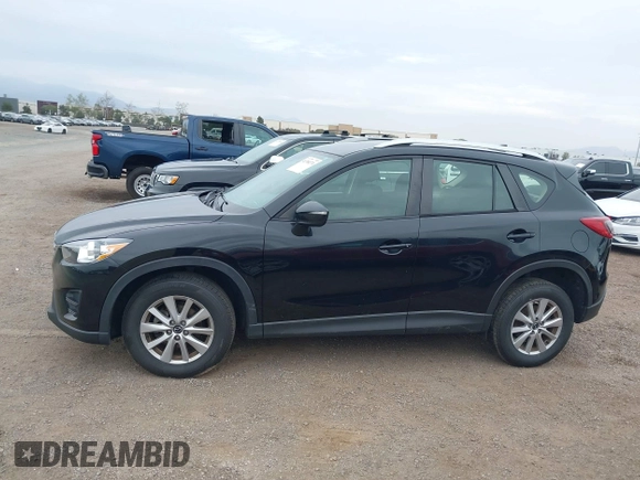 2016 Mazda CX-5 Sport with VIN JM3KE2BY4G0761933, listed as a IAAI auction lot 41709274 with 131,127 mi miles. Bid and sale history available at carsss.com. Image 15.