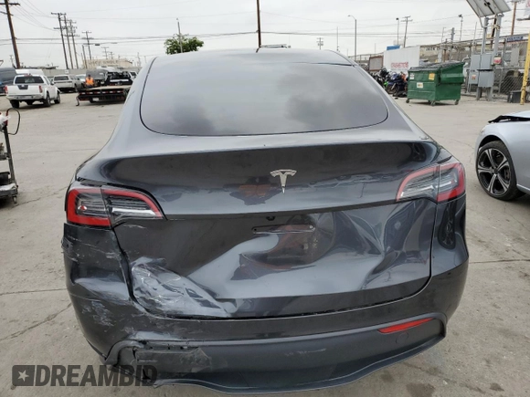 2025 Tesla Model Y Long Range with VIN 7SAYGDED4SF242721, listed as a Copart auction lot 56159955 with 7,131 mi miles and Salvage Title. Bid and sale history available at DreamBid. Image 6.