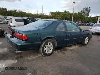 1994 Ford Thunderbird LX with VIN 1FALP62W6RH128762, listed as a Copart auction lot 84306604 with 68,314 mi miles and Salvage Title. Bid and sale history available at DreamBid. Image 3.