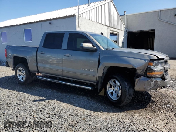 2017 Chevrolet Silverado 1500 LT with VIN 3GCUKREC0HG335785, listed as a Copart auction lot 51456305 with 104,614 mi miles and Salvage Title. Bid and sale history available at DreamBid. Image 4.