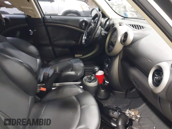 2012 MINI Countryman S with VIN WMWZC5C58CWL60067, listed as a IAAI auction lot 42081725 with 104,397 mi miles and . Bid and sale history available at DreamBid. Image 5.