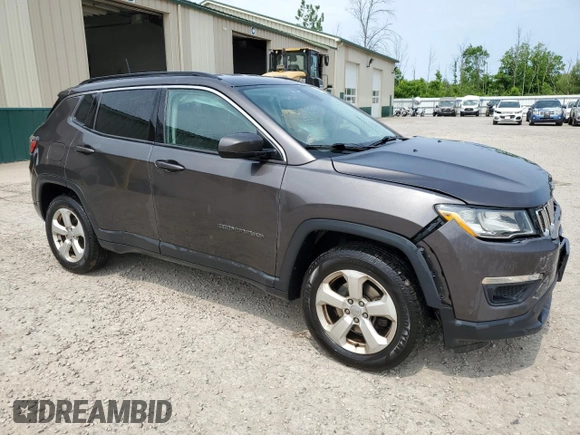 2018 Jeep Compass Altitude with VIN 3C4NJDBB9JT457242, listed as a Copart auction lot 60886385 with 143,467 mi miles and Salvage title. Bid and sale history available at DreamBid. Image 4.