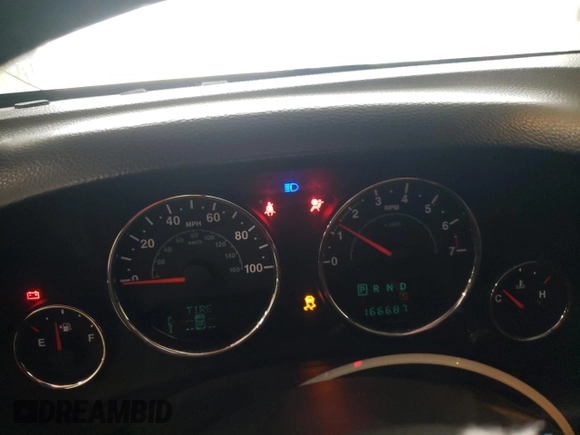 2013 Jeep Wrangler Sahara z VIN 1C4AJWBG4DL504800, wystawiony jako Copart lot #60504575 z przebiegiem 166 687 mil mil oraz Szkoda całkowita • Salvage title. Historia ofert i sprzedaży dostępna na DreamBid. Obrazek 9.