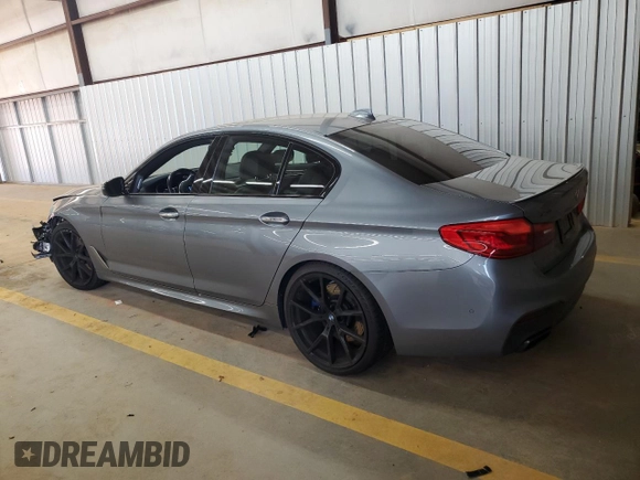 2018 BMW 5 Series M550i xDrive with VIN WBAJB9C55JB050213, listed as a Copart auction lot 61714255 with 34,700 mi miles and Salvage title. Bid and sale history available at DreamBid. Image 2.