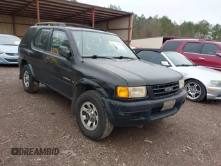 1998 Isuzu Rodeo S z VIN 4S2CK58W2W4343850, wystawiony jako IAAI lot #41415432 z przebiegiem 240 590 mil mil oraz . Historia ofert i sprzedaży dostępna na DreamBid. Obrazek 1.