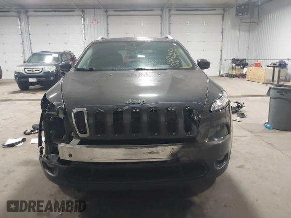 2014 Jeep Cherokee Altitude with VIN 1C4PJMCB2EW317346, listed as a IAAI auction lot 41861651 with 100,602 mi miles. Bid and sale history available at carsss.com. Image 12.