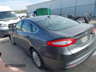 2015 Ford Fusion SE Hybrid with VIN 3FA6P0LUXFR266743, listed as a IAAI auction lot 40862039 with 116,610 mi miles. Bid and sale history available at carsss.com. Image 14.