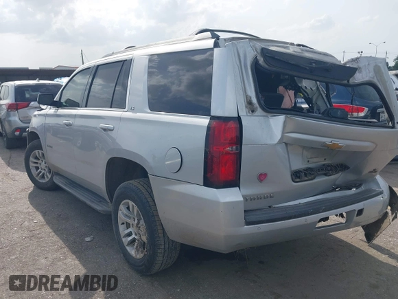 2016 Chevrolet Tahoe LS with VIN 1GNSCAEC2GR392937, listed as a IAAI auction lot 42648714 with 166,764 mi miles and . Bid and sale history available at DreamBid. Image 3.
