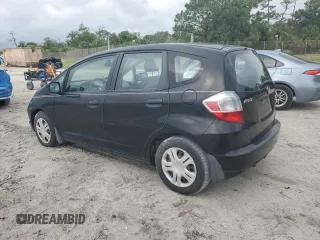 2009 Honda Fit with VIN JHMGE88249S068080, listed as a Copart auction lot 52469735 with 222,156 mi miles and Clean Title. Bid and sale history available at carsss.com. Image 2.
