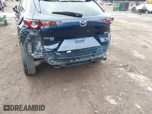 2022 Mazda CX-30 S Premium with VIN 3MVDMBDL0NM413545, listed as a IAAI auction lot 42493594 with 57,013 mi miles and . Bid and sale history available at DreamBid. Image 6.