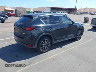 2018 Mazda CX-5 Touring z VIN JM3KFACM5J0309533, wystawiony jako IAAI lot #42195429 z przebiegiem 91 928 mil mil oraz . Historia ofert i sprzedaży dostępna na DreamBid. Obrazek 4.