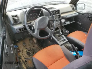 1992 Geo Tracker z VIN 2CNBJ18U8N6938728, wystawiony jako Copart lot #79459914 z przebiegiem 17 751 mil mil oraz Szkody całkowita. Historia ofert i sprzedaży dostępna na DreamBid. Obrazek 8.