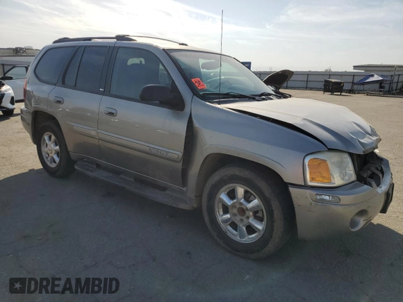 2003 GMC Envoy SLE with VIN 1GKDS13S332390989, listed as a Copart auction lot 74729104 with 127,680 mi miles and Salvage Title. Bid and sale history available at DreamBid. Image 4.