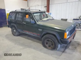 1996 Jeep Cherokee Sport with VIN 1J4FJ68S8TL282160, listed as a Copart auction lot 70670014 with 217,003 mi miles and Clean Title. Bid and sale history available at carsss.com. Image 4.
