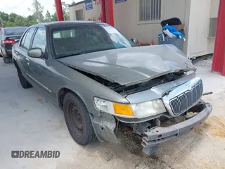 2001 Mercury Grand Marquis GS z VIN 2MEFM74W41X702619, wystawiony jako IAAI lot #42323749 z przebiegiem 124 748 mil mil oraz . Historia ofert i sprzedaży dostępna na DreamBid. Obrazek 1.