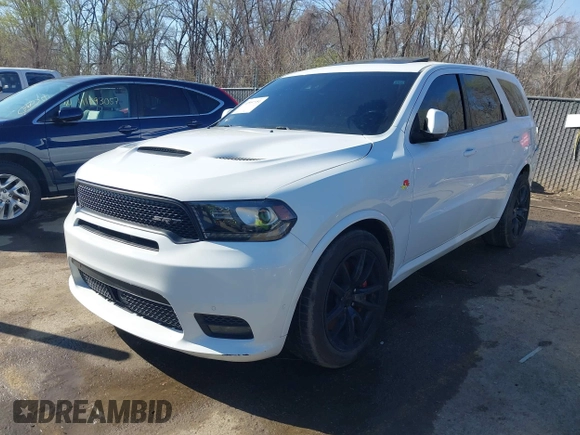 2018 Dodge Durango SRT with VIN 1C4SDJGJXJC395094, listed as a IAAI auction lot 41857351 with 90,106 mi miles and . Bid and sale history available at DreamBid. Image 2.