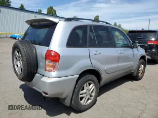 2003 Toyota RAV4 with VIN JTEGH20V936012689, listed as a Copart auction lot 61997965 with 214,693 mi miles and Clean title. Bid and sale history available at DreamBid. Image 3.