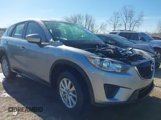 2014 Mazda CX-5 Sport with VIN JM3KE4BE9E0423362, listed as a IAAI auction lot 42033101 with 103,819 mi miles and . Bid and sale history available at DreamBid. Image 1.