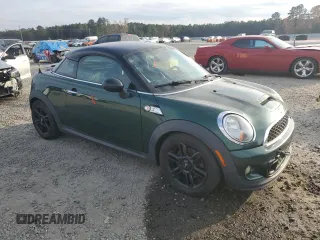 2013 MINI Coupe S z VIN WMWSX3C51DT409008, wystawiony jako Copart lot #82781914 z przebiegiem 122 465 mil mil oraz Tytuł czysty. Historia ofert i sprzedaży dostępna na DreamBid. Obrazek 4.