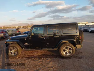 2018 Jeep Wrangler JK Unlimited Sahara with VIN 1C4HJWEG0JL810480, listed as a IAAI auction lot 41260609 with 69,776 mi miles. Bid and sale history available at carsss.com. Image 15.