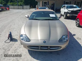 2002 Jaguar XK with VIN SAJDA42C32NA24378, listed as a IAAI auction lot 42205854 with 92,612 mi miles and . Bid and sale history available at DreamBid. Image 6.