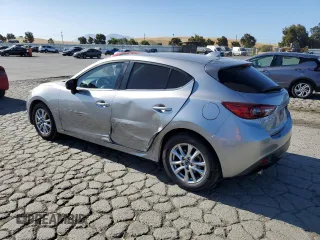 2015 Mazda 3 i Grand Touring z VIN JM1BM1M70F1260802, wystawiony jako Copart lot #60662705 z przebiegiem 89 974 mil mil oraz Szkoda całkowita • Salvage title. Historia ofert i sprzedaży dostępna na DreamBid. Obrazek 2.