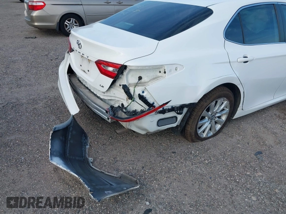 2019 Toyota Camry LE with VIN 4T1B11HK7KU806197, listed as a IAAI auction lot 41721148 with 83,373 mi miles and . Bid and sale history available at DreamBid. Image 6.