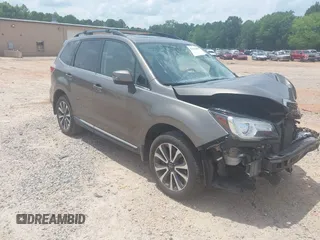 2017 Subaru Forester Touring with VIN JF2SJGWCXHH558789, listed as a IAAI auction lot 42518698 with 112,294 mi miles and . Bid and sale history available at DreamBid. Image 1.