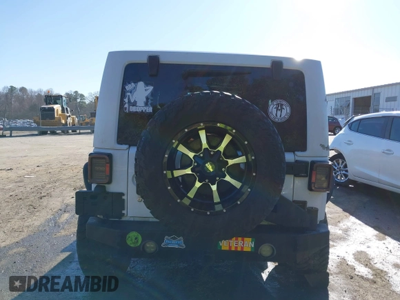 2014 Jeep Wrangler Sport with VIN 1C4AJWAG0EL245337, listed as a IAAI auction lot 41532314 with 140,721 mi miles and . Bid and sale history available at DreamBid. Image 16.